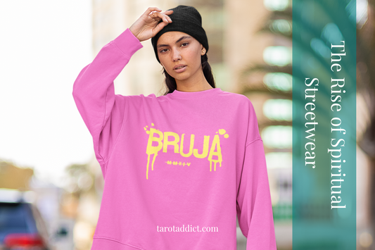 Woman wearing a pink crewneck sweatshirt with the word Bruja.